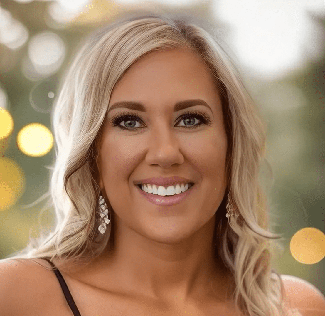 Smiling woman with blonde hair outdoors